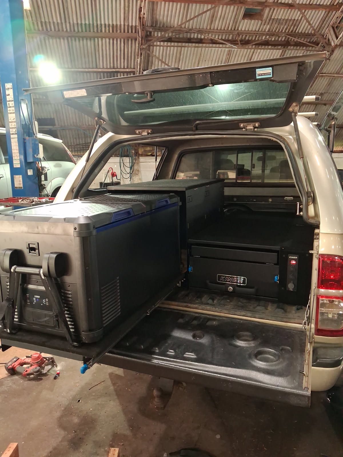 A 4WD touring fitout with fridge slide and drawers, built at the Nixon Auto Electrics & Mechanical workshop in Atherton